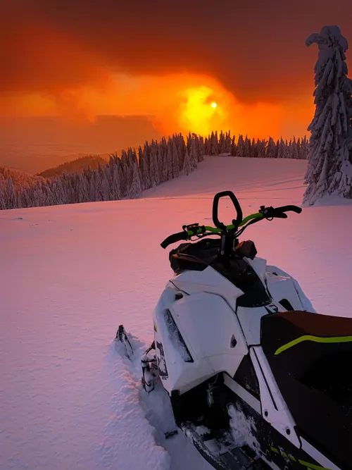 Snowmobile at sunset