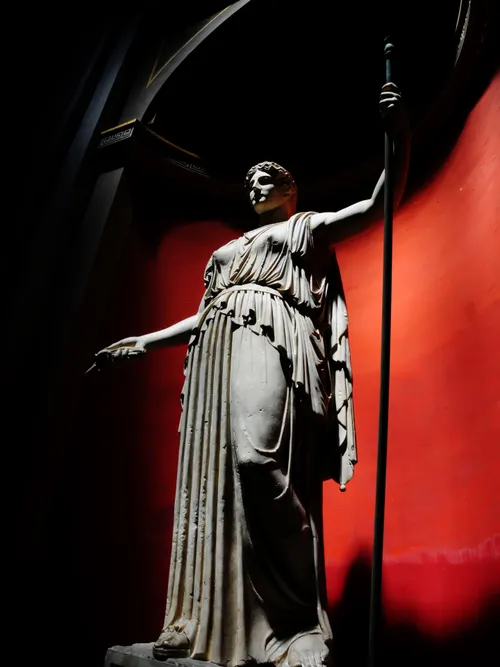 Statue holding rod