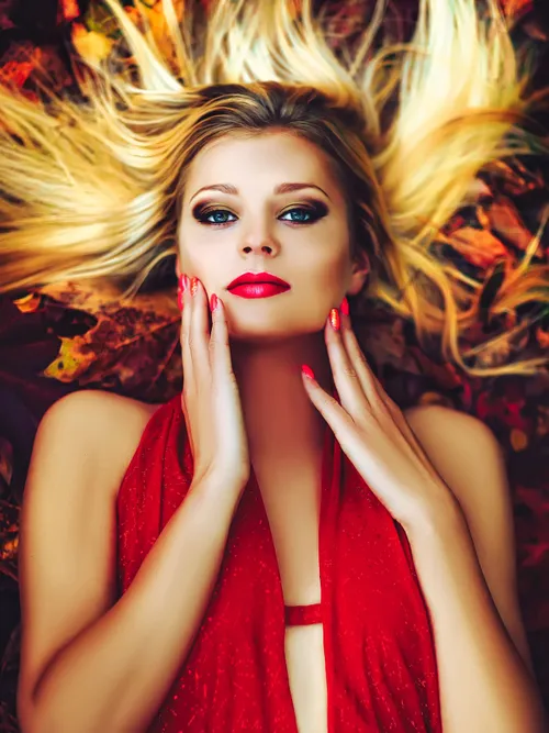 Model lying on leaves