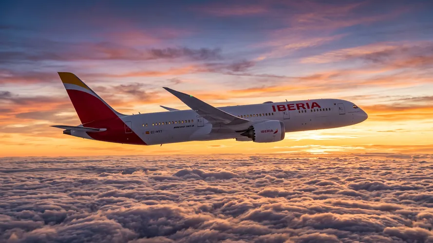 Iberia Airplane Flying Above Clouds